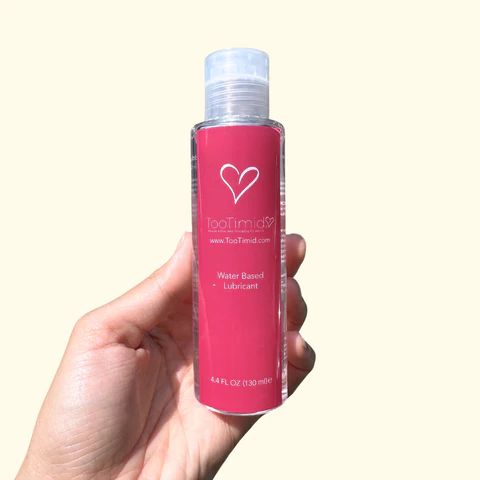 4.4oz TooTimid Water-Based Lubricant Bottle in hand